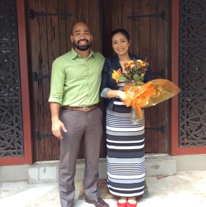 domoREALTY clients David and Jane in front of their midcentury modern home on closing day.