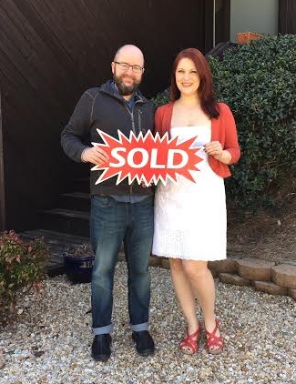 Happy Domo Realty clients in front of their contemporary home in metro Atlanta.